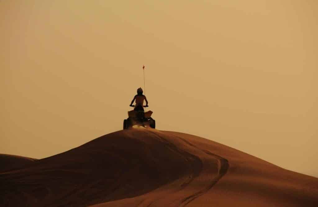 quad biking during evening desert safari dubai